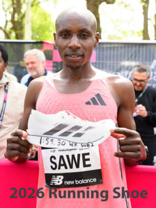 Sabastian Sawe sub-2 hour marathon running holding Super Shoe