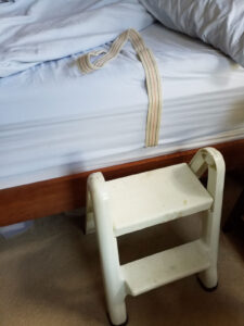 Footstool to enter bed. Belt to pull on when moving in bed